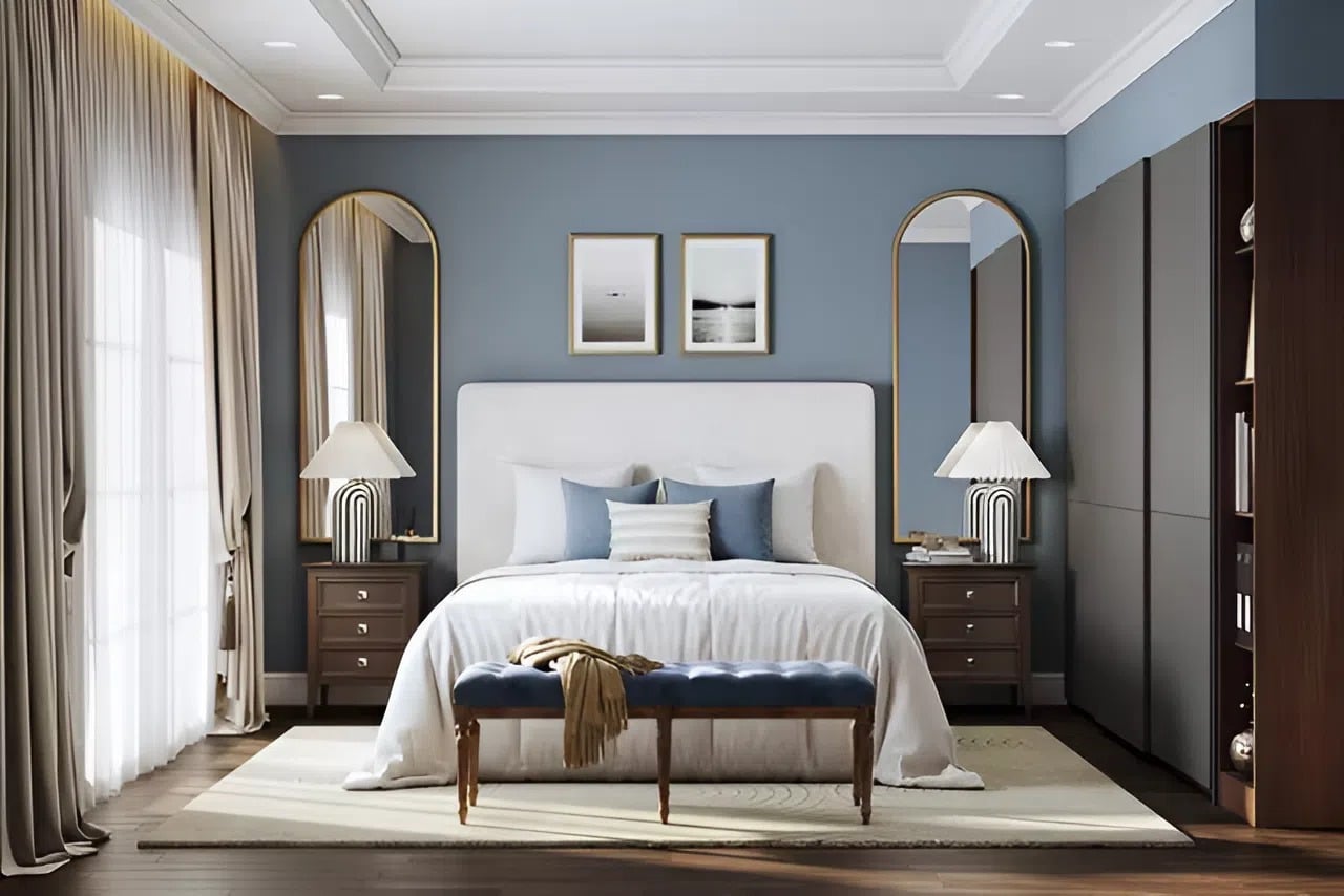 Bedroom with muted blue walls, clean edges, and refined ceiling details by a house painter in Jacksonville, FL