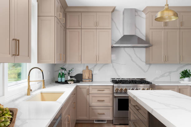 Smooth beige painted kitchen cabinets with a clean finish and even coverage by a cabinet painter in Jacksonville, FL